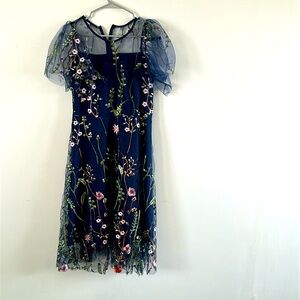 Floral dress with illusion sweetheart neckline.
